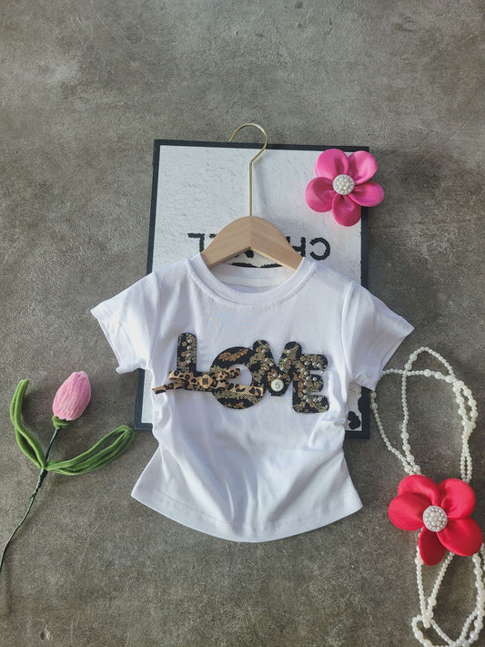 Panterrokje met wit shirtje met kralen & steentjes β set of los ππ€β¨